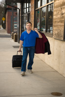 18069 Jeff Beuhl with suitcase